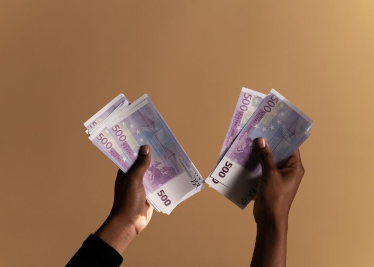 hands holding money
