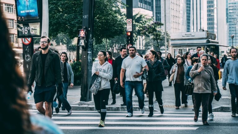people crossing a busy street